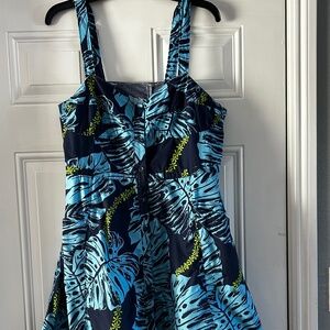Fitted summer dress with slanted patch pockets and center front button facing